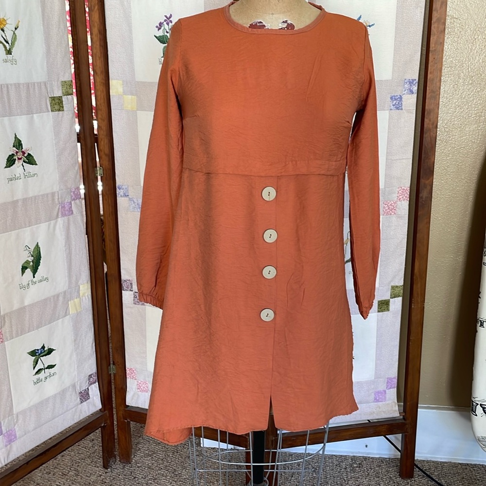 Tofisa cotton/polyester loose, flattering, flared tunic, brick/rust color